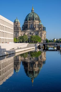 The Berlin Cathedral with the reconstructed City Palace reflected in the river Spree