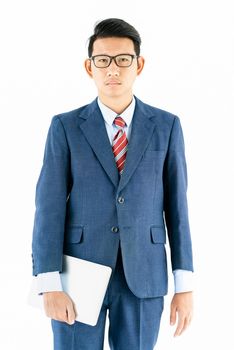 Young asian businessman portrait in suit and wear glasses holding a laptop over white background