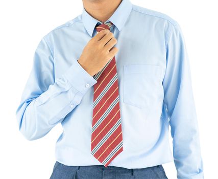 Close up, Male wearing blue shirt and red tie, he tighten the tie knot with clipping path