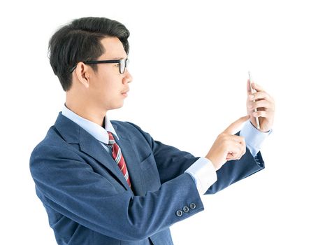 Young asian business men portrait in suit  holding smartphone against white background