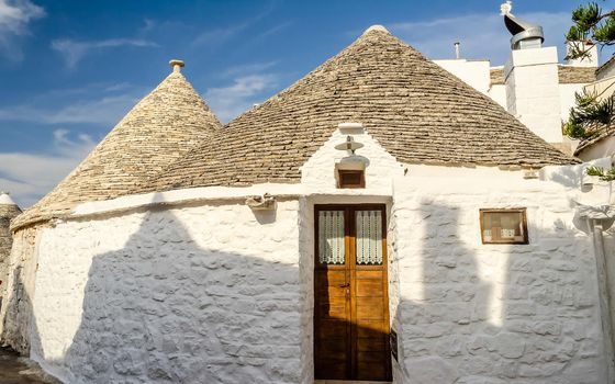Typical trulli buildings with conical roofs in Alberobello, Apulia, Italy