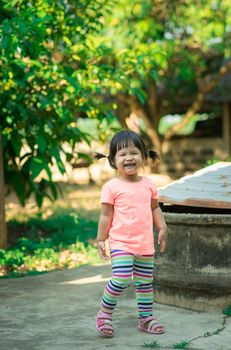 child girl feel happy standing in the park