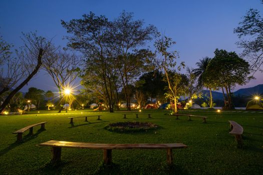 circle bench under a lamp in the park at night