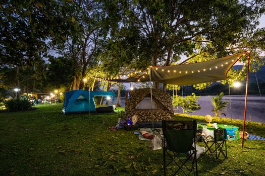 Camping and tent in nature park at evening time