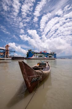 George Town, Penang/Malaysia - Jun 27 2017: Traditional fishing boat and ferry in hot sunny day.