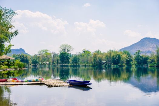 boats docked on a mountain lake in countryside
