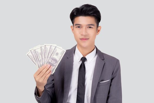 Young asian business man holding money dollar isolated on white background, businessman in suit holding banknote and success and excited with finance, savings and investment, income and spending.