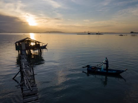 George Town, Penang/Malaysia - Nov 22 2019: Fisherman cast net in morning.