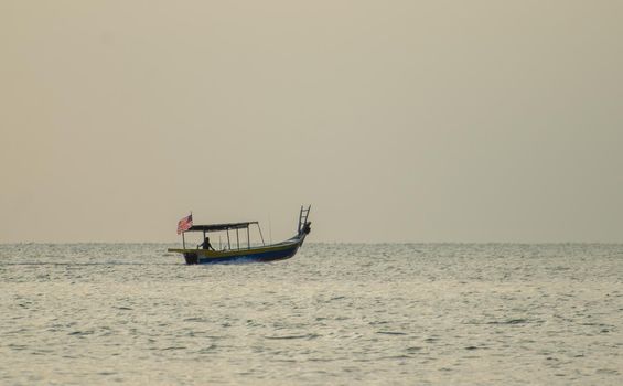 George Town, Penang/Malaysia - Dec 28 2019: A boat with Malaysia flag move at sea.