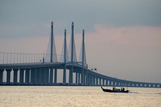 George Town, Penang/Malaysia - Dec 28 2019: A sighing boat move toward main span of Penang second Bridge.