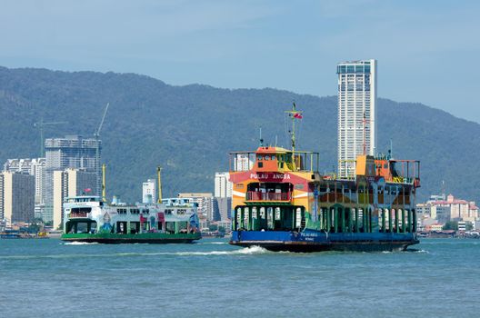 Butterworth, Penang/Malaysia - Jan 01 2020: Two ferry move at Penang sea.