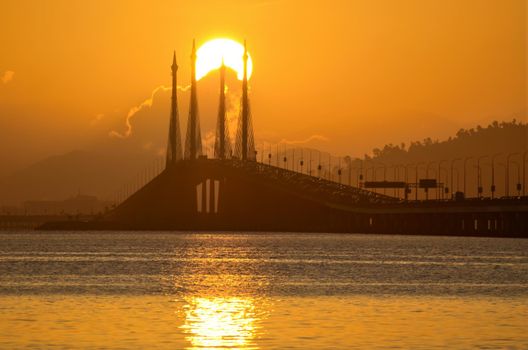 Georgetown, Penang/Malaysia - Feb 19 2020: Sun rise from the cloud at Penang Bridge.