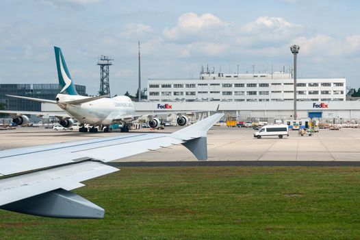 05/26/2019 Frankfurt Airport, Germany. Federal Express - Fed Ex sorting depot with Boeing 747 in front of the main office building.