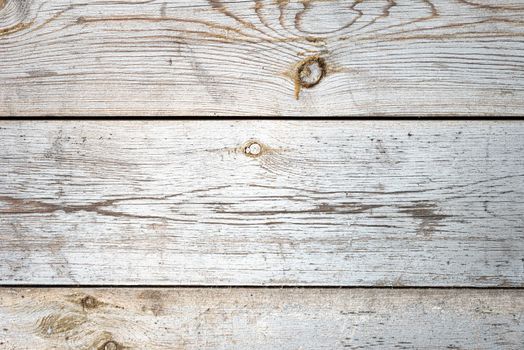 Old textures wooden peeled board with knots