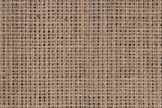 Top view of natural brown hessian or burlap cloth or gunny sack, formed of jute. Abstract texture background