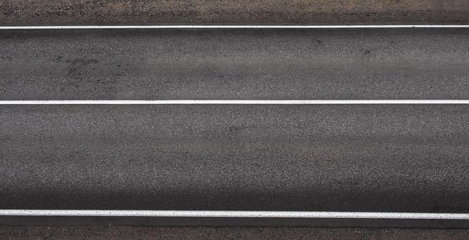 Asphalt highway grey texture with three white stripes