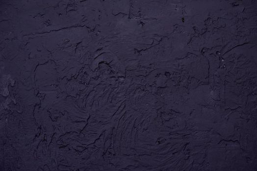 Black background made with a texture of a plaster wall