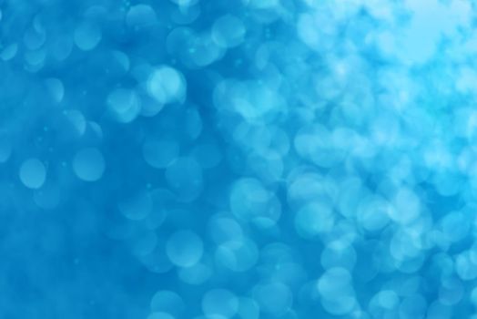 Blue christmas festive elegant abstract background with bokeh lights