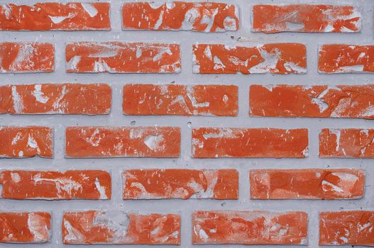 Bright red clay bricks wall flat background texture pattern