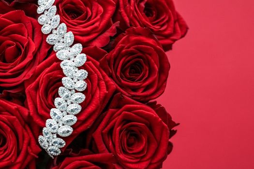 Gemstone jewellery, wedding fashion and luxe shopping concept - Luxury diamond bracelet and bouquet of red roses, jewelry love gift on Valentines Day and romantic holidays present