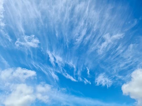 Stunning cirrus cloud formation panorama in a deep blue summer sky seen over Europe