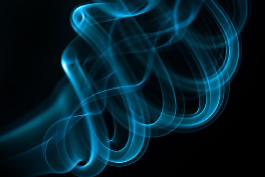 Blue smoke isolated on black background.