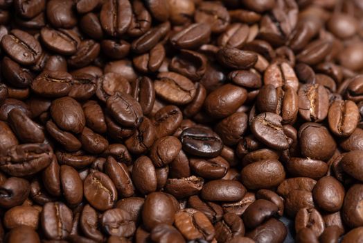 Fresh brown roasted coffee beans background