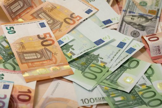 Background of dollar, euro banknotes laying on a table