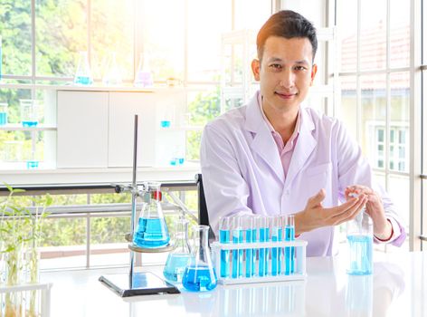 Asian scientist or medical researcher Test concept for producing 75% alcohol-based hand sanitizer for hand washing in case of sterilization of bacteria and preventing the coronavirus, COVID-19