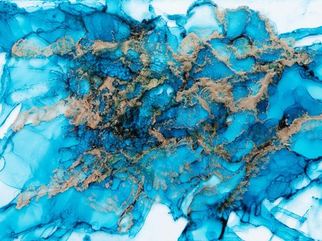 Alcohol ink fluid art. Waves in blue colors with liquid golden inclusion. Abstract marble background or texture
