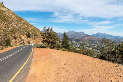 View of the Franschhoek Pass in the Western Cape Province. A vehicle and Franchhoek are visible