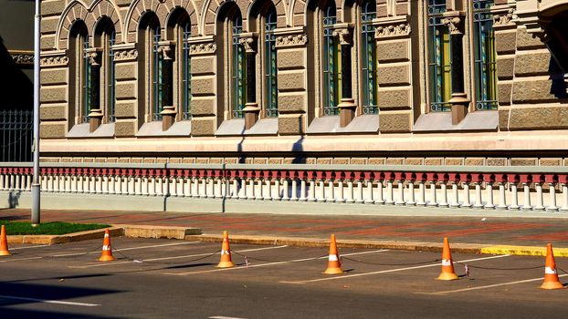 Empty car parking near a beautiful old building. High quality photo.Place for temporary or permanent parking. 