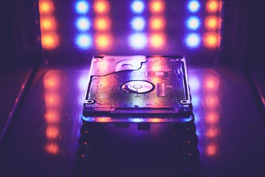 The abstract image of hard disk drive on the technician's desk as a component. the concept of data, hardware, and information technology.