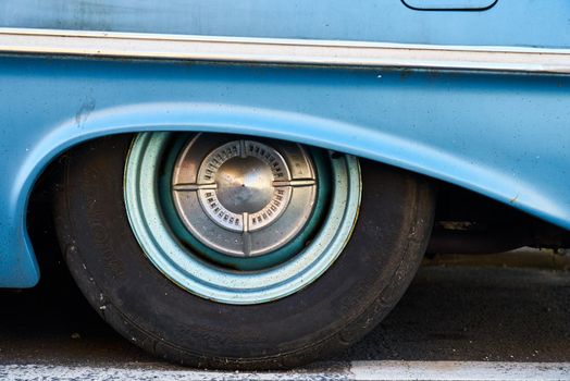 Detail of the wheel arch on a blue 1961 4 door Chevrolet Bel Air sedan