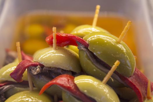 Olives with hot red pepper. No people. No copy space