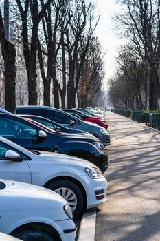 Parked cars along the street. Bucharest, Romania, 2021