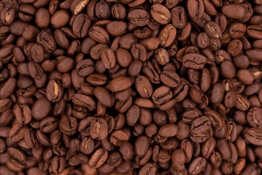 Fresh brown roasted coffee beans flat background