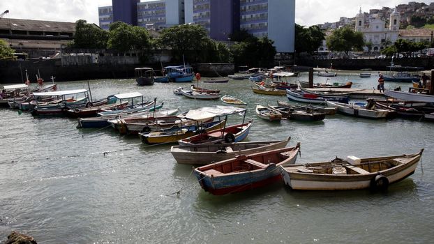 salvador, bahia, brazil - june 28, 2021: Fishing boats are seen moored in a port at Feira de Sao Joaquim in Salvador city.

