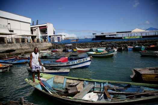 salvador, bahia, brazil - june 28, 2021: Fishing boats are seen moored in a port at Feira de Sao Joaquim in Salvador city.

