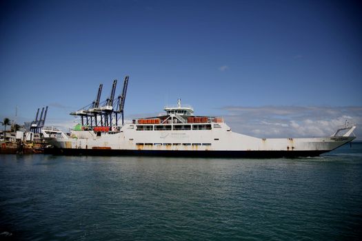 salvador, bahia, brazil - june 28, 2021: Ferry Boat Zumbi dos Palmares seen during approach at Terminal de Sao Joaquim in Salvador city, after crossing Todos os Santos Bay.
