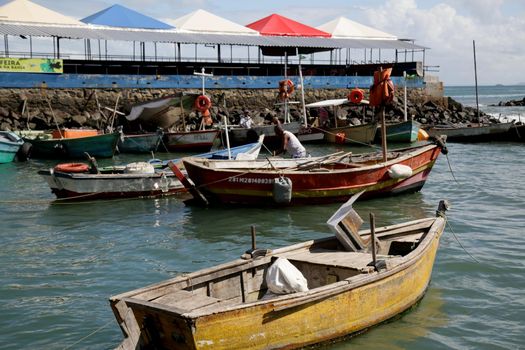 salvador, bahia, brazil - june 28, 2021: Fishing boats are seen moored in a port at Feira de Sao Joaquim in Salvador city.


