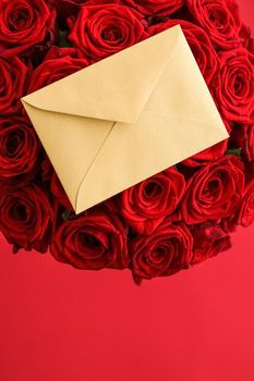 Holiday gift, flowers flatlay and happy relationship concept - Love letter and flower delivery service on Valentines Day, luxury bouquet of red roses and card envelopes on red background