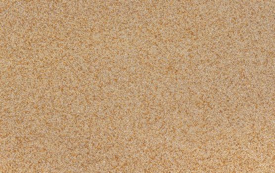 Detailed texture of golden glitter dust surface, luxury background