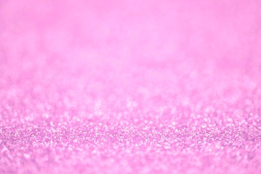 Texture of pink glitter dust surface, luxury background with bokeh