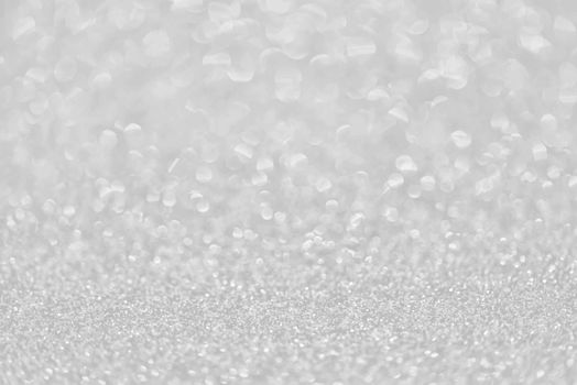 Texture of silver glitter dust surface, luxury background with bokeh