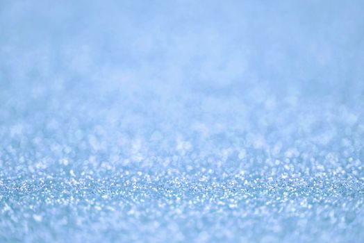 Texture of blue silver glitter dust surface, luxury background with bokeh