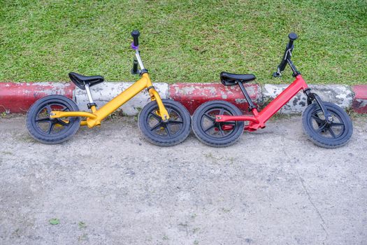 Kids balance bike lying on roadside