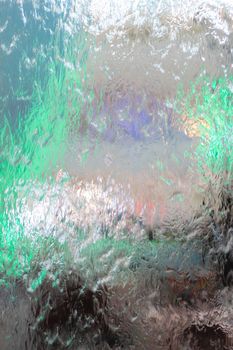 Water flows on the glass background