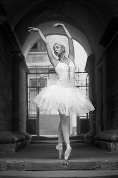 Ballet virtuoso. Soft focus monochrome shot of a dancing ballerina outdoors