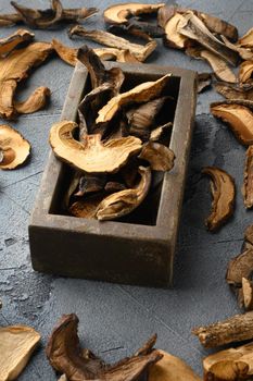 Wild organic dried porcini mushroom set, on gray background